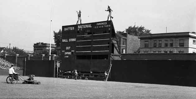 Doublemint elves atop the scoreboard, temporarilty in left field for 1937 renovations